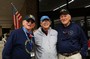 Post Legionnaires Dr. Carter Davis and Bill Edwards with a patriotic American.